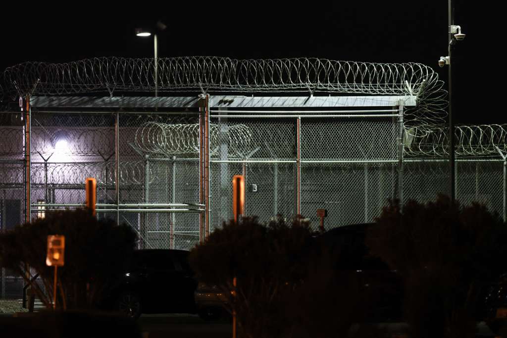 Barbed wire fencing surrounds the GEO Group Adelanto ICE Processing Center detention facility in Adelanto, California on July 10, 2025.