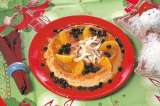Flan de coco bañado en salsa de naranja con pasas