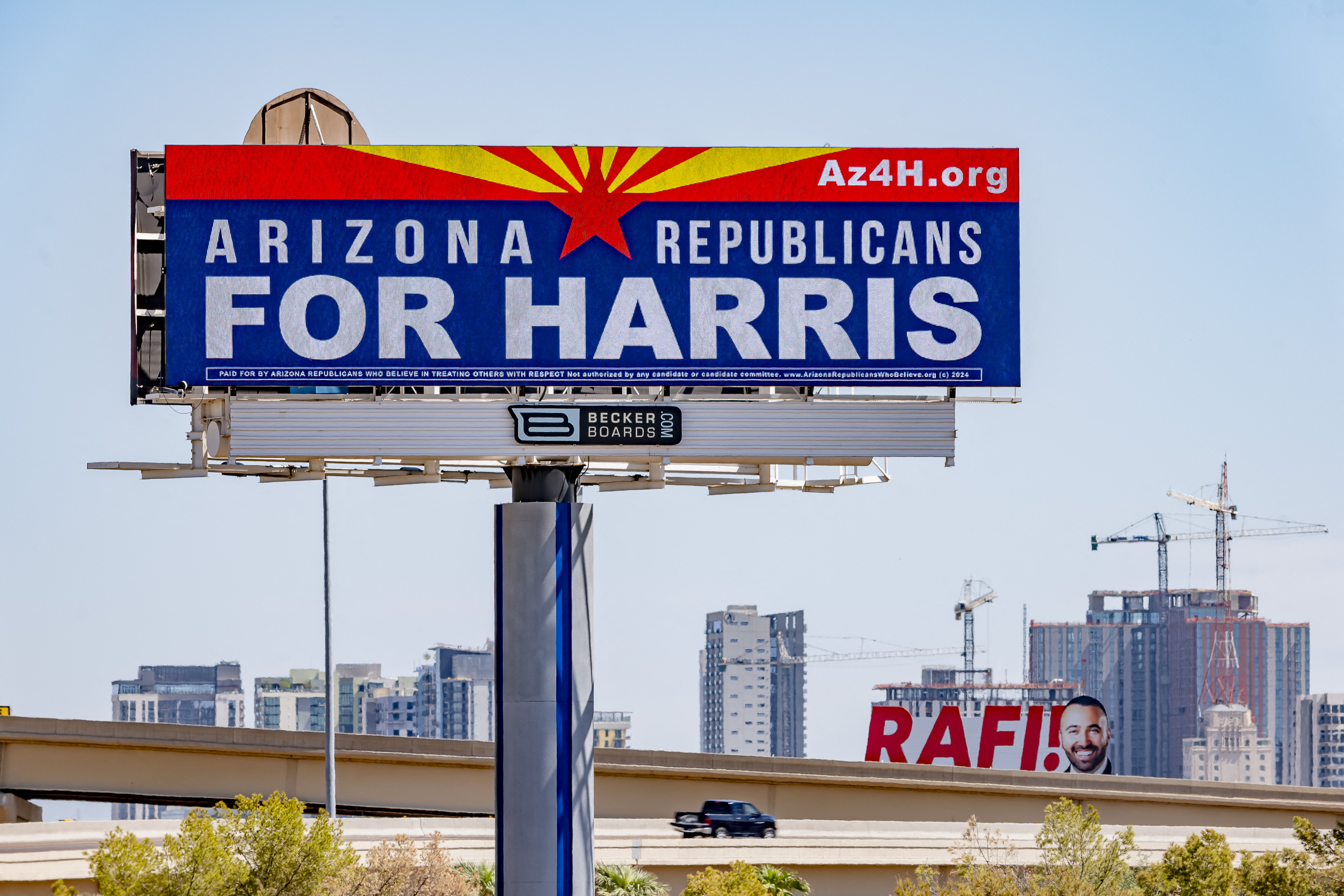 A billboard at the intersection of Interstate 17 and Interstate 10 reads "Arizona Republicans for Harris" in Phoenix, Arizona on September 19, 2024.
