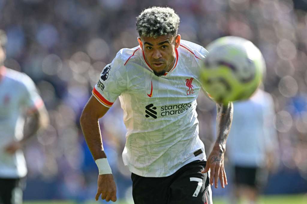 Liverpool's Colombian midfielder #07 Luis Diaz chases the ball during the English Premier League football match between Crystal Palace and Liverpool at Selhurst Park in south London on October 5, 2024. (Photo by Glyn KIRK / AFP) / RESTRICTED TO EDITORIAL USE. NO USE WITH UNAUTHORIZED AUDIO, VIDEO, DATA, FIXTURE LISTS, CLUB/LEAGUE LOGOS OR 'LIVE' SERVICES. ONLINE IN-MATCH USE LIMITED TO 120 IMAGES. AN ADDITIONAL 40 IMAGES MAY BE USED IN EXTRA TIME. NO VIDEO EMULATION. SOCIAL MEDIA IN-MATCH USE LIMITED TO 120 IMAGES. AN ADDITIONAL 40 IMAGES MAY BE USED IN EXTRA TIME. NO USE IN BETTING PUBLICATIONS, GAMES OR SINGLE CLUB/LEAGUE/PLAYER PUBLICATIONS.
