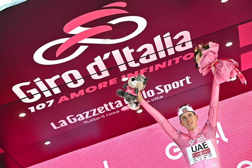Perugia (Italy), 10/05/2024.- Slovenian rider Tadej Pogacar of UAE Team Emirates celebrates on the podium retaining the overall leader's pink jersey after the winnig the 7th stage of 107 Giro d'Italia, an individual time trial 40,6 km from Foligno to Perugia, Italy, 10 May 2024. (Ciclismo, Italia, Eslovenia) EFE/EPA/LUCA ZENNARO