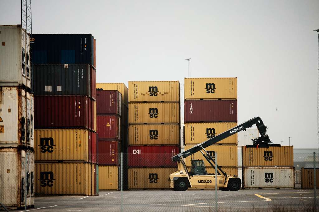 Stacked shipping containers on a dock at Aarhus Havn in Aarhus, Denmark.