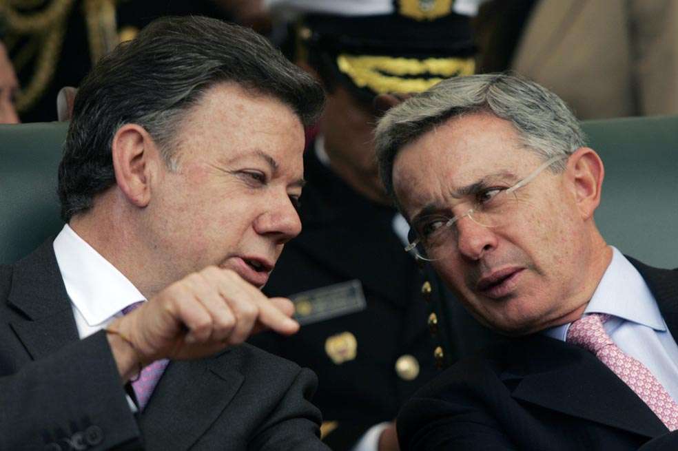 REFILE - CORRECTING DATE
Colombia's president-elect Juan Manuel Santos speaks with President Alvaro Uribe (R) during a ceremony at Army School in Bogota August 6, 2010. Santos will succeed Uribe on August 7. REUTERS/Fredy Builes (COLOMBIA - Tags: POLITICS)