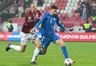 Norway's forward #09 Erling Braut Haland (L) and Israel's defender #05 Idan Nachmias vie for the ball during the 2026 World Cup Group I qualifier football match between Israel and Norway, in Debrecen, Hungary, on March 25, 2025.