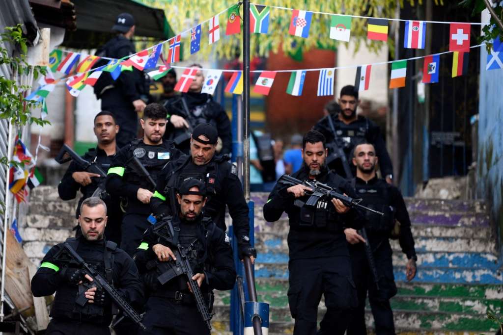 Brazilian Civil Police officers patrol a street during the Operation Containment at the Santa Marta favela, in Rio de Janeiro, Brazil, on June 23, 2026.