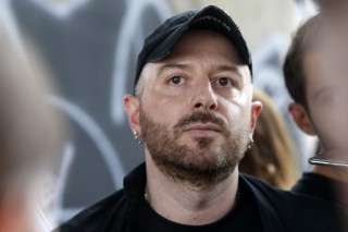 (FILES) Fashion designer for Vetements, Demna Gvasalia talks to people at the end of his men and women's Spring/Summer 2019 collection fashion show, in Paris, on July 1, 2018.