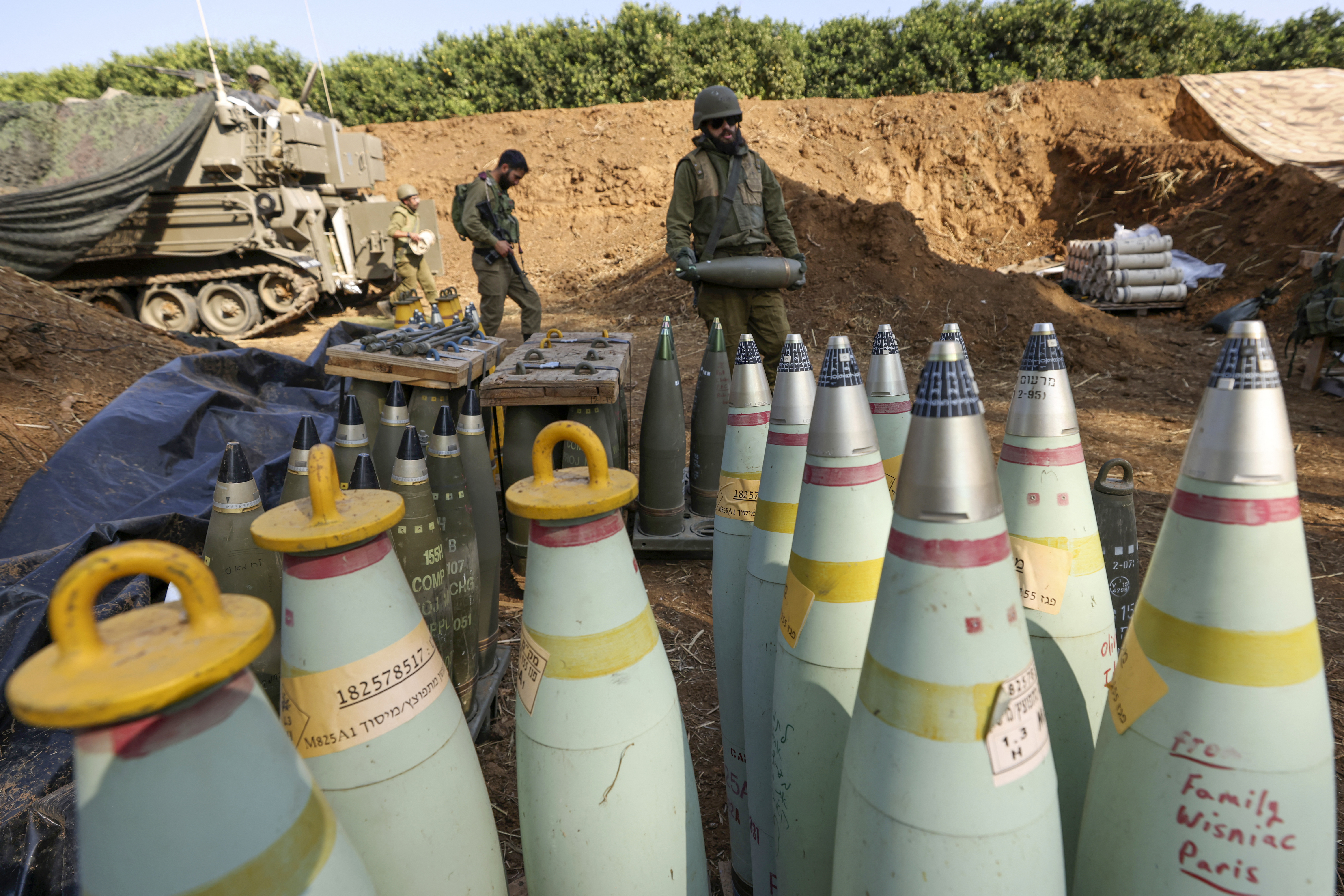 (FILES) An Israeli soldier prepares artillery shells as forces take positions in Upper Galilee in northern Israel near the Lebanon border on November 15, 2023, amid increasing cross-border tensions as fighting continues with Hamas militants in the southern Gaza Strip.