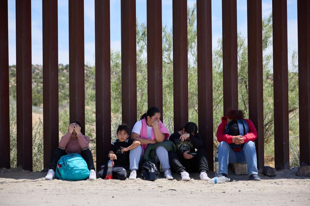 Jacumba (United States), 04/06/2024.- Migrants wait for US Border Patrol after crossing the US Mexico border in Jacumba, California, USA, 04 June 2024. Today, US President Joe Biden signed an executive order tightening restrictions on migrants seeking asylum at the US Mexico border. The order is expected to go into effect immediately. EFE/EPA/ALLISON DINNER