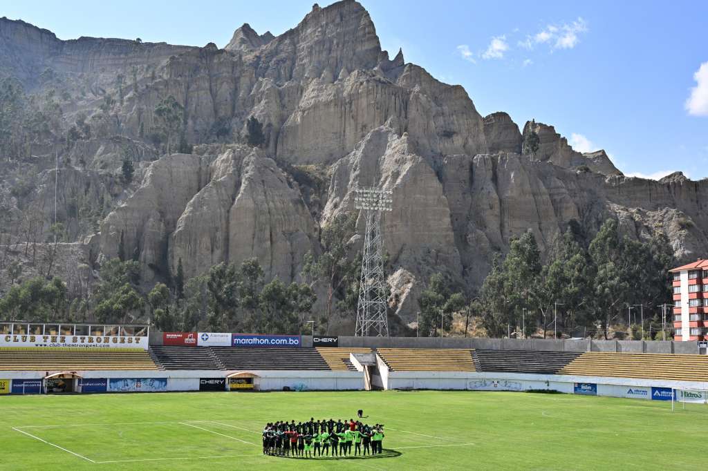Bolivia's national team football players gather in a huddle during a training session at the Rafael Mendoza Stadium in La Paz on October 6, 2024.