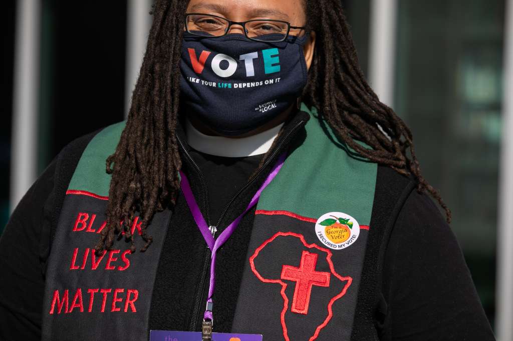 ATLANTA, GA - NOVEMBER 03: Polling chaplain Rev. Kimberly Jackson stands outside of the Metropolitan Library on November 3, 2020 in Atlanta, Georgia. After a record-breaking early voting turnout, Americans head to the polls on the last day to cast their vote for incumbent U.S. President Donald Trump or Democratic nominee Joe Biden in the 2020 presidential election. Jessica McGowan/Getty Images/AFP