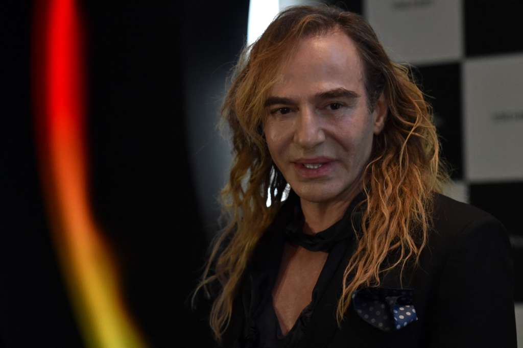 (FILES) British designer John Galliano gives a press conference on his new work as a consultant for Russian cosmetics retailer L'Etoile in at the Barvikha Luxury Village Concert Hall just outside Moscow, on May 22, 2014. Galliano, who was ousted from fashion house Dior over an anti-Semitic outburst, landed himself a new job in Russia as a consultant for L'Etoile.