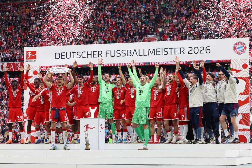 FC Bayern Munich players celebrate as Bayern Munich's German midfielder #08 Leon Goretzka (4th L) raises the trophy after the German first division Bundesliga football match between FC Bayern Munich and FC Cologne in Munich, southern Germany, on May 16, 2026. (Photo by Alexandra BEIER / AFP) / DFL REGULATIONS PROHIBIT ANY USE OF PHOTOGRAPHS AS IMAGE SEQUENCES AND/OR QUASI-VIDEO