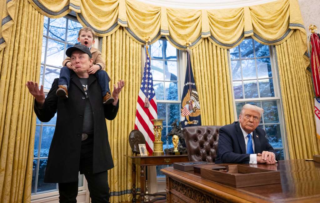 (FILES) Tesla and SpaceX CEO Elon Musk (L) with his son X Æ A-Xii join US President Donald Trump (R) as he signs executive orders in the Oval Office of the White House in Washington, DC, February 11, 2025.