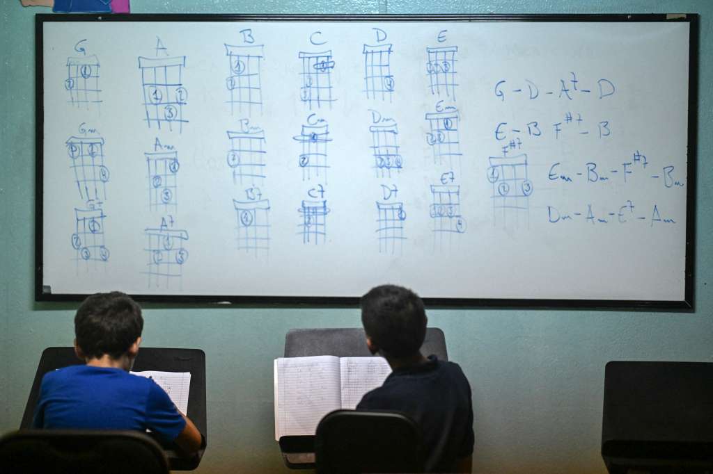 Students participate in a music class at the Fe y Alegria school in the Las Mayas neighborhood in Caracas on October 21, 2024.