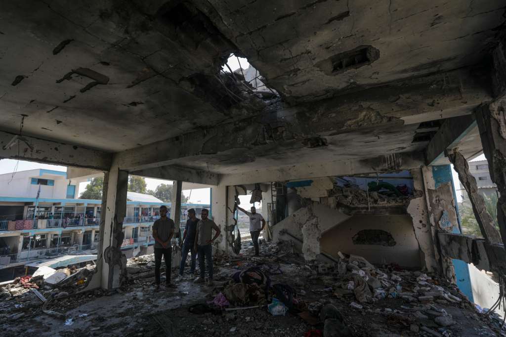 Al Nusairat Refugee Camp (-), 06/06/2024.- Palestinians inspect a destroyed UNRWA school following Israeli airstrike at Al Nusairat refugee camp in the central Gaza Strip, 06 June 2024. According to the Palestinian News Agency Wafa, at least 32 people were killed and dozens others were injured on early 06 June following an Israeli strike on a UNRWA school sheltering displaced Palestinians, located in the Nuseirat refugee camp in the central Gaza strip. The Israeli army said that it had "conducted a precise strike on a Hamas compound", whose members were " embedded in the UNRWA school". More than 36,000 Palestinians and over 1,400 Israelis have been killed, according to the Palestinian Health Ministry and the Israel Defense Forces (IDF), since Hamas militants launched an attack against Israel from the Gaza Strip on 07 October 2023, and the Israeli operations in Gaza and the West Bank which followed it. EFE/EPA/MOHAMMED SABER