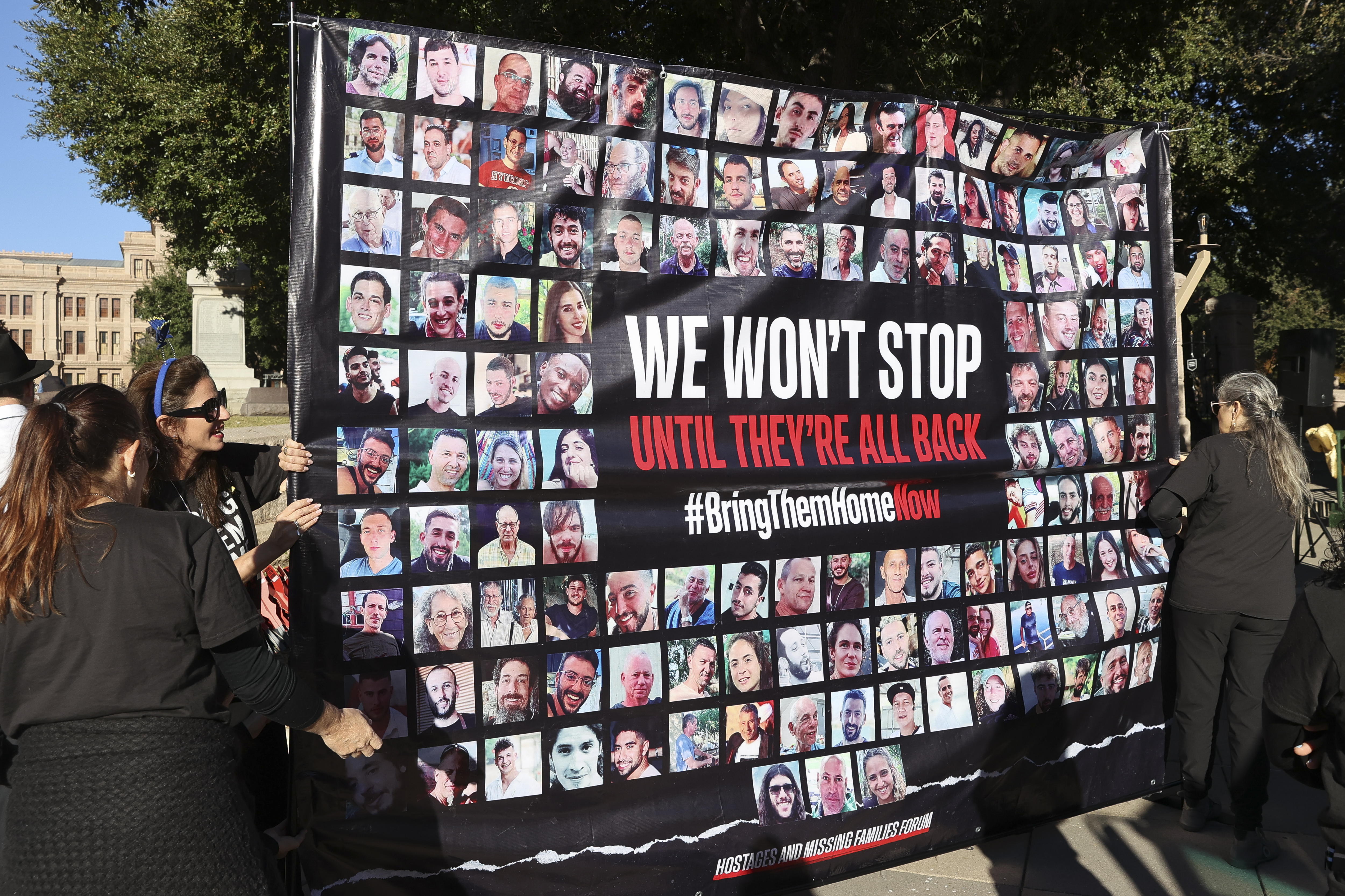 Austin (United States), 10/12/2023.- A banner of all the missing hostages from the 07 October Hamas attack in Israel is displayed during a menorah lighting ceremony attended by Texas Governor Greg Abbott at the Texas State Capitol in Austin, Texas, USA, 10 December 2023. Abbott participated at the annual menorah lighting ceremony at the Texas Capitol on Hanukkah's fourth night, also known as the 'Festival of Lights.' EFE/EPA/ADAM DAVIS