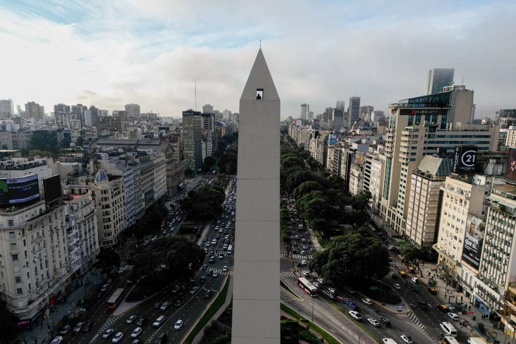 TOPSHOT - Aerial view showing a man looking down from the Obelisk observation deck in Buenos Aires on May 8, 2025.