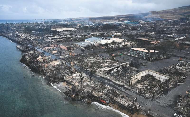 Los incendios en Hawaii fueron el evento que más pérdidas por persona generó este año. (Photo by Patrick T. Fallon / AFP)
