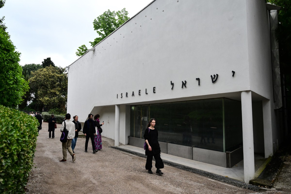 Visitors walk near the Israeli Pavilion, closed for restoration, during the pre-opening press view of the 61st Venice Art Biennale in Venice on May 5, 2026.