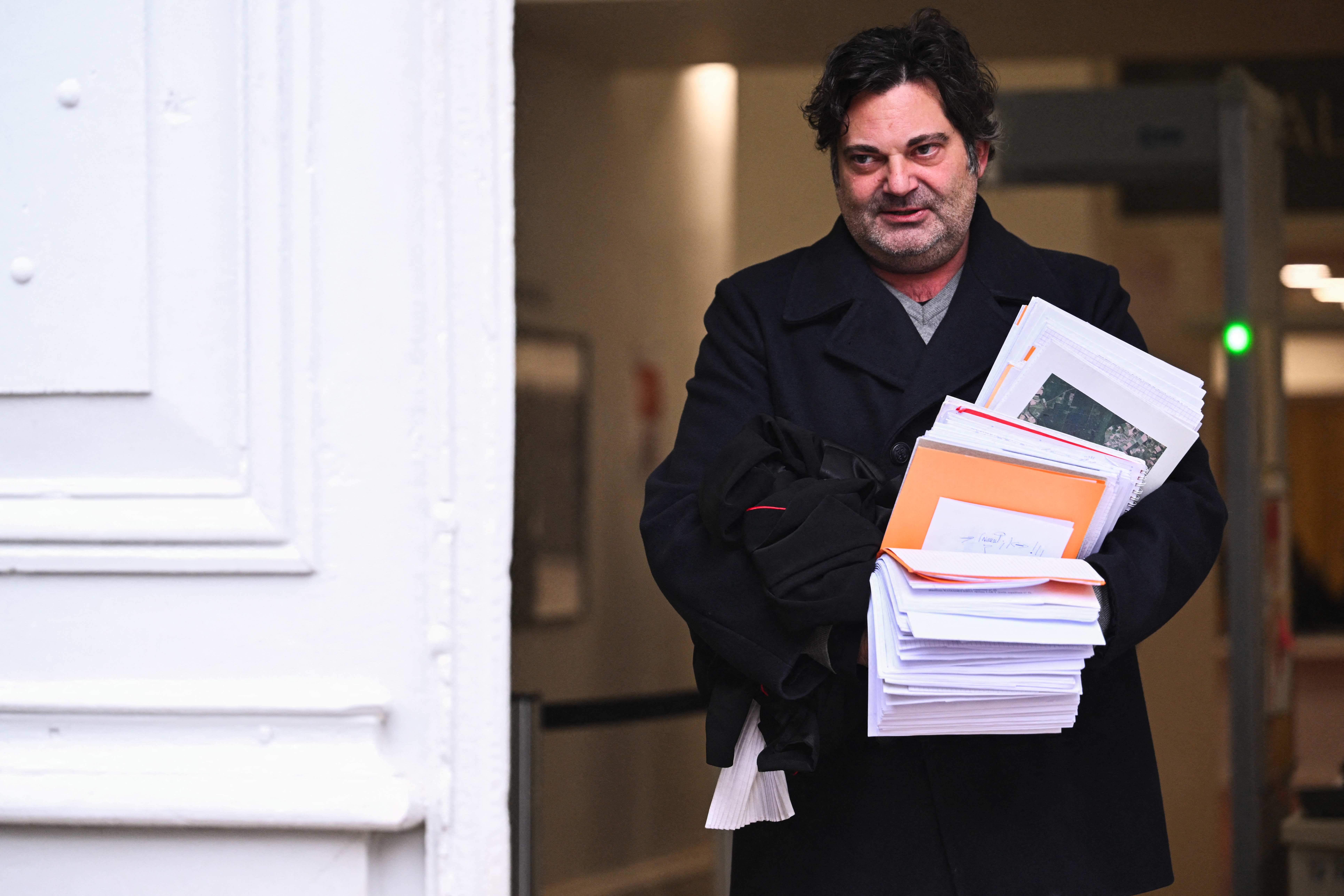 French lawyer Randall Schwerdorffer, representing Arthur Del Piccolo, boyfriend of murdered Japanese student Narumi Kurosaki, leaves the courthouse following the verdict of the appeal trial of Nicolas Zepeda, a Chilean man accused of allegedly murdering his Japanese ex-girlfriend in France in 2016, at Vesoul courthouse, eastern France on December 21, 2023. A French appeals court on December 21, 2023 jailed Nicolas Zepeda for the murder of his Japanese ex-girlfriend in 2016. (Photo by SEBASTIEN BOZON / AFP)