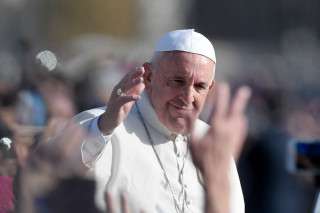 (FILES) Pope Francis greets the crowd from the popemobile after the celebration of a mass marking the end of the Jubilee of Mercy, on November 20, 2016 in Vatican.