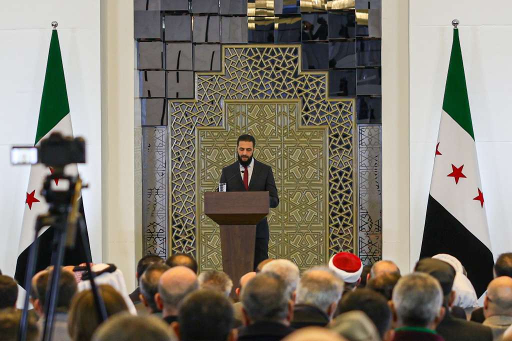 Damascus (Syrian Arab Republic), 25/02/2025.- Syrian interim President Ahmed al-Sharaa delivers a speech during the Syrian National Dialogue Conference in Damascus, Syria, 25 February 2025. The conference, which aims to approve recommendations related to the foundations of the country's upcoming transitional phase, kicked off with the participation of hundreds of figures representing the spectrum of Syrian society. (Siria, Damasco) EFE/EPA/MOHAMMED AL RIFAI