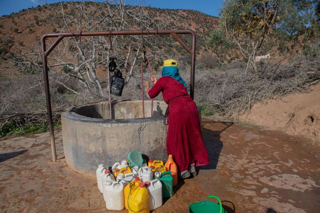 Mall El Bilad (Morocco), 18/01/2024.- Village woman Fatima is extracting water from a well near her residence, despite the fact that the water level has decreased due to the drought, which has struck Morocco for many consecutive years, in Mall El Bilad, Morocco, 18 January 2024. Morocco suffers from a long-term drought and a severe water shortage, with rainfall decreasing by 67 percent, according to the Minister of Equipment and Water Nizar Baraka, which prompted the government to announce several restrictive measures. (sequía, Marruecos) EFE/EPA/Jalal Morchidi