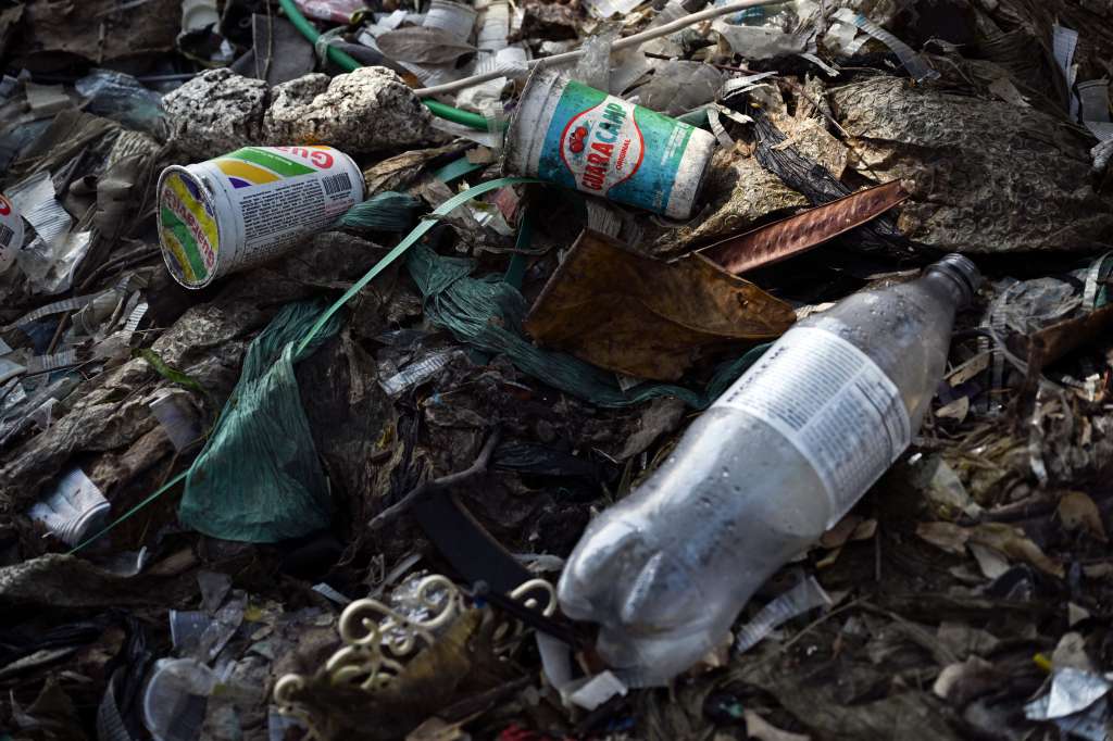 Plastic waste and garbage is seen at Guanabara Bay on a shore at the Fundao island, north zone of Rio de Janeiro, Brazil, on September 12, 2024. (Photo by Mauro PIMENTEL / AFP)
