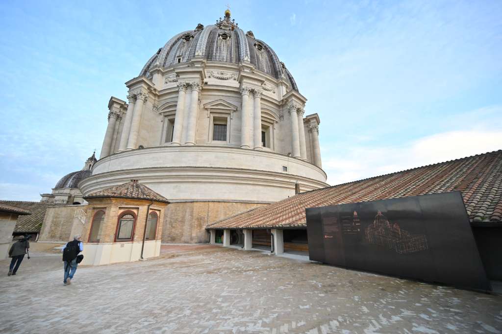 Journalists walk on a terrace of St Peter's basilica during the press preview of "St. Peter's Basilica AI-Enhanced experience" at The Vatican on November 9, 2024.