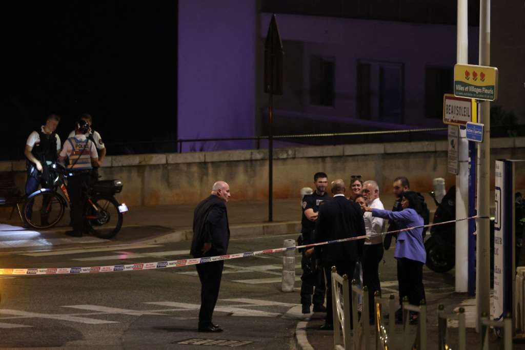 Mayor of Menton Alexandra Masson (R) and Mayor of Beausoleil Gerard Spinelli (3rdR), two French towns neighbouring Monaco, speak with police officers near the area of an explosion that occurred in a residential building in Monaco, near the border with France on June 29, 2026.
