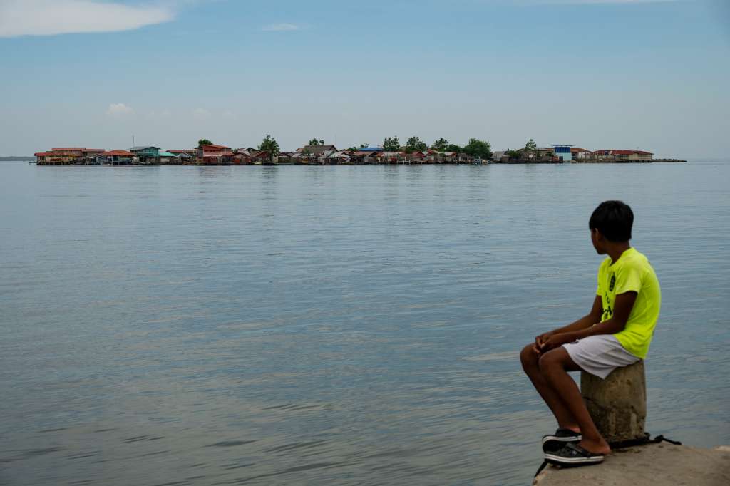 (FILES) A child looks at Carti Tupile Island from Gardi Sugdub island, in the Guna Yala Archipelago, Panama on May 27, 2025.