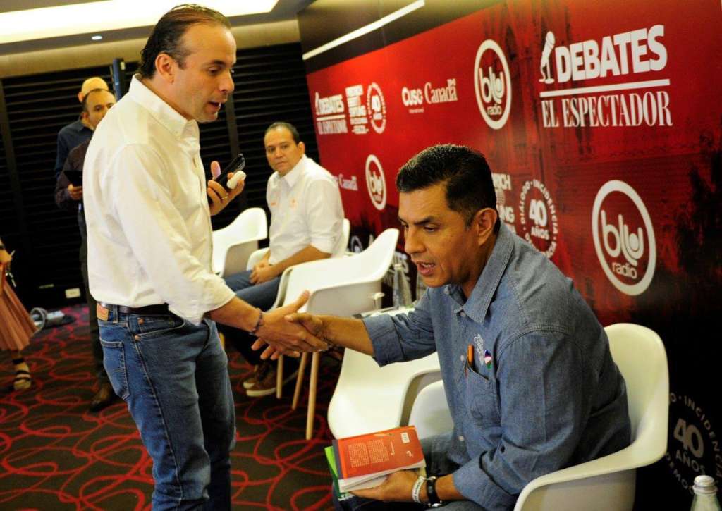 Alejandro Eder y Jorge Iván Ospina, durante el debate de esta mañana en Cali.  / Nelson Sierra G - El Espectador