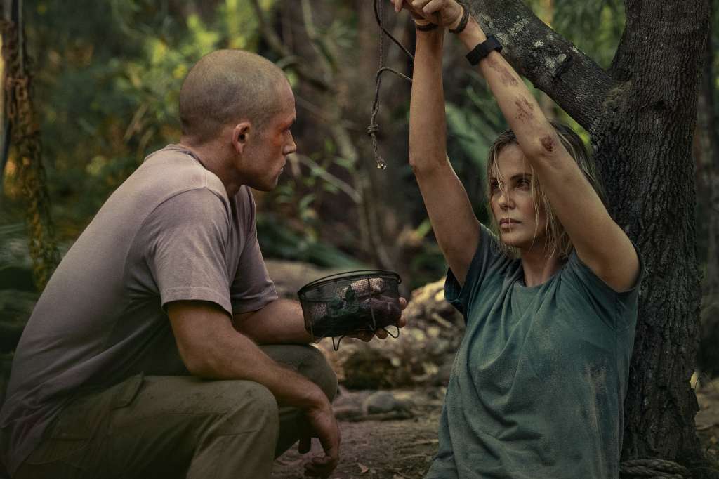 APEX. (L-R) Taron Egerton as Ben and Charlize Theron as Sasha in APEX. Cr. Kane Skennar/Netflix © 2026