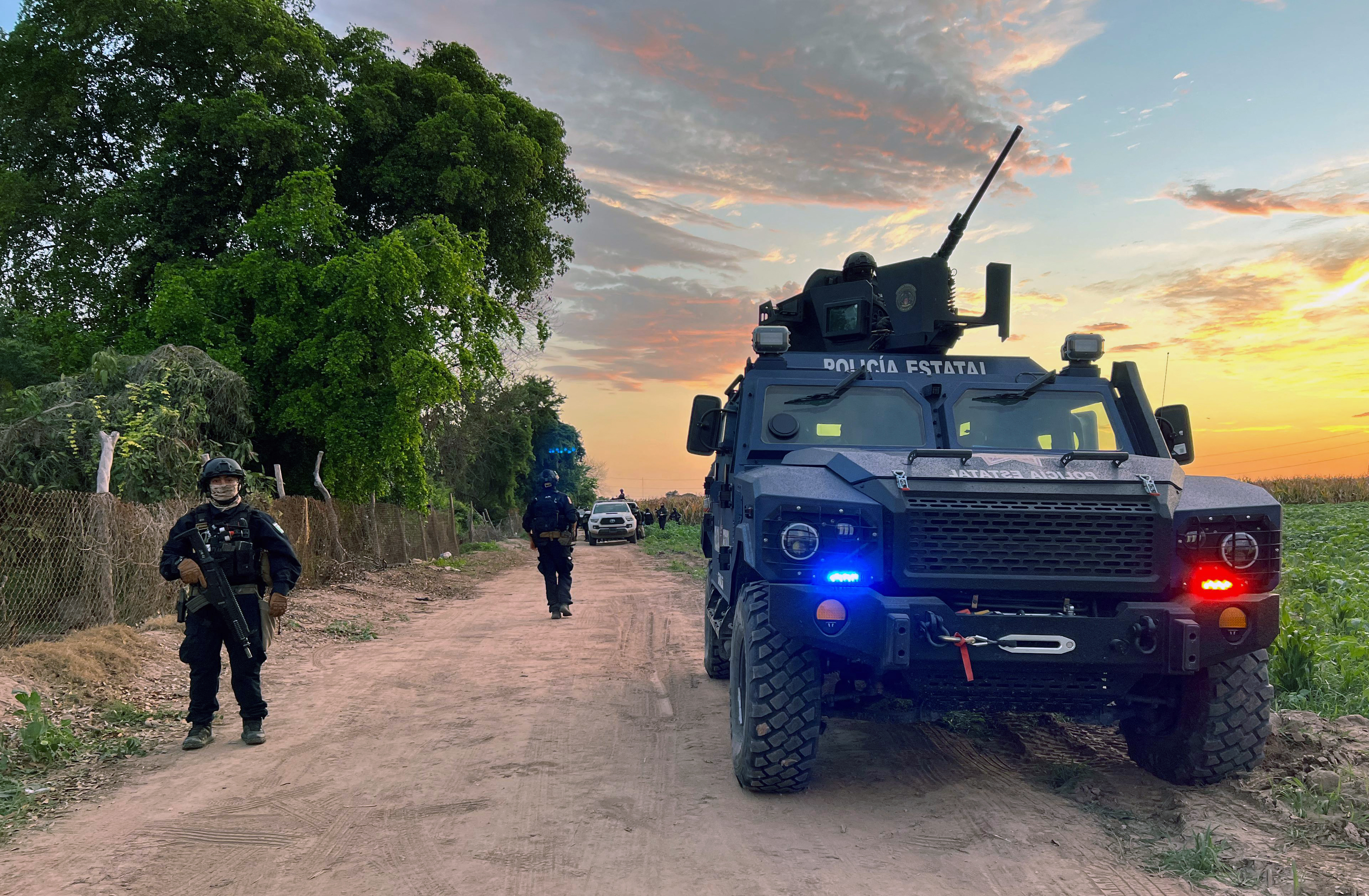 State Police officers patrol during an operation against organized crime at the San Pedro agricultural field in the municipality of Navolato, Sinaloa state, Mexico on July 25, 2025.