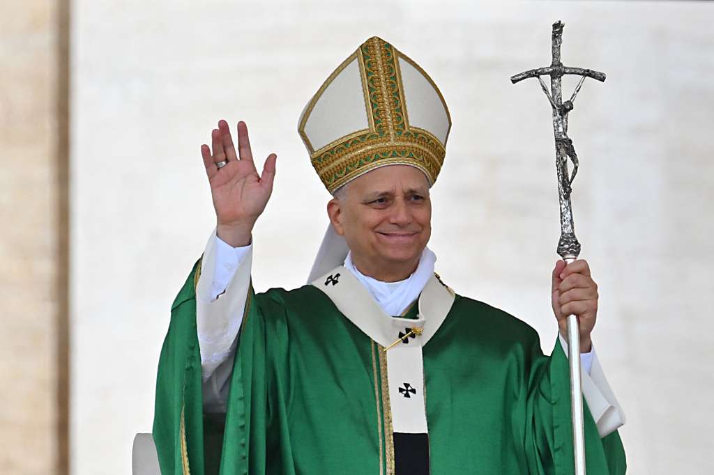 Pope Leo XIV waves as he celebrates the Jubilee Mass for the missionary world and migrants at St. Peter's Square at the Vatican on October 5, 2025.
