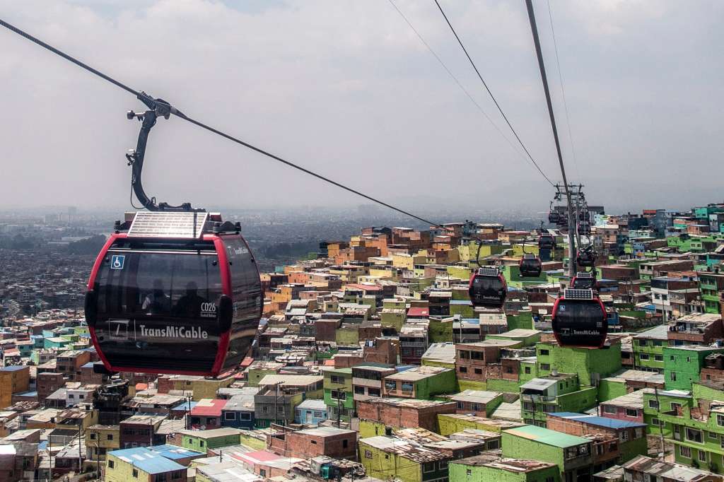 "TransMiCable" cable car carriages pass above Ciudad Bolivar neighbourhood in Bogota on April 14, 2024.