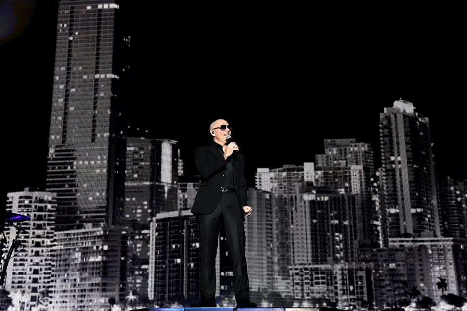 Pitbull en concierto. / AFP
