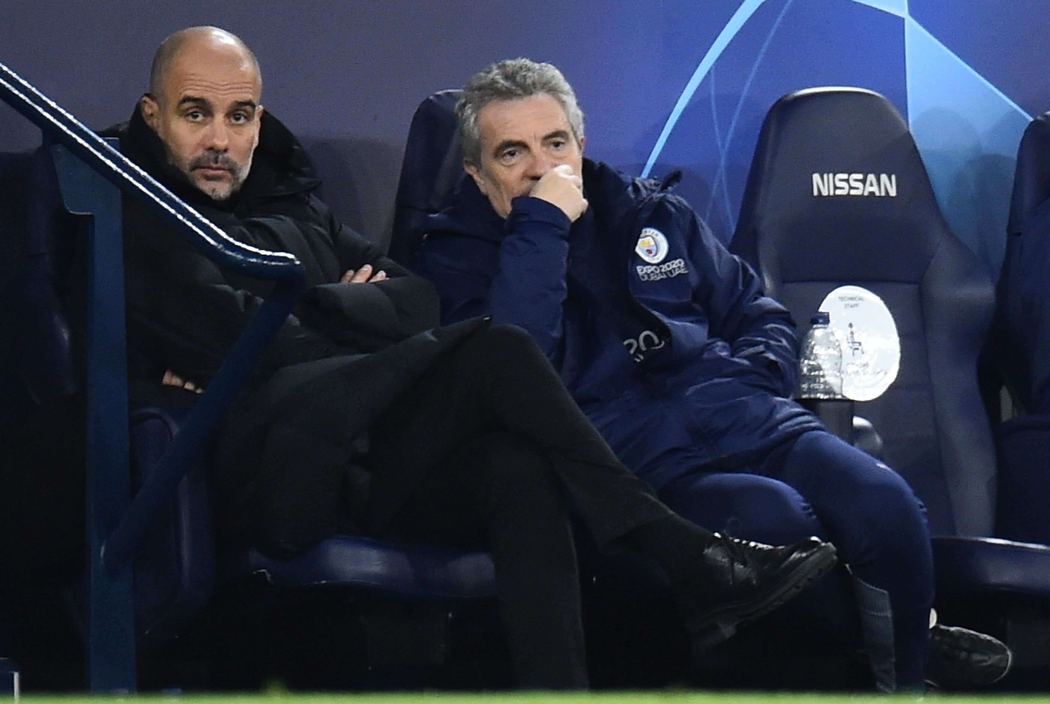 Manchester (United Kingdom), 09/03/2022.- Manchester City's manager Pep Guardiola (L) and assistant manager Juan Manuel Lillo (R) react during the UEFA Champions League round of 16, second leg soccer match between Manchester City and Sporting Lisbon in Manchester, Britain, 09 March 2022. (Liga de Campeones, Reino Unido, Lisboa) EFE/EPA/PETER POWELL