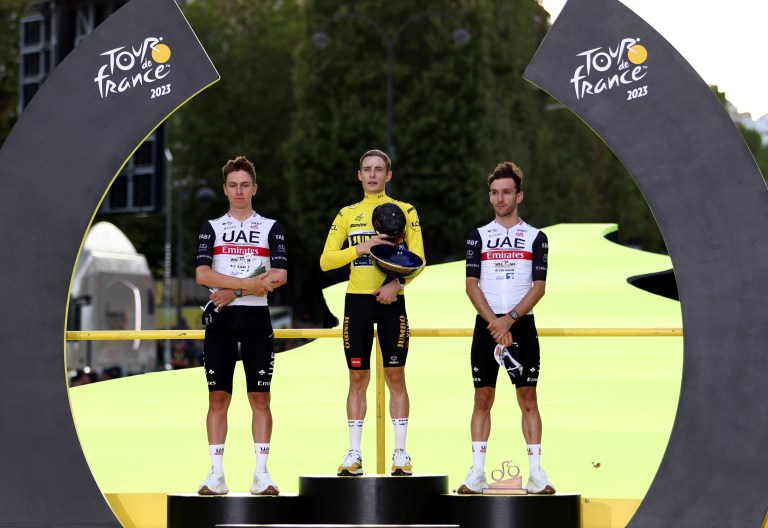 Paris (France), 23/07/2023.- (L-R) Second placed Slovenian rider Tadej Pogacar of UAE Team Emirates, winner, Danish rider Jonas Vingegaard of Jumbo Visma and third placed British rider Adam Yates of team UAE Team Emirates celebrate on the podium after the 21st and final stage of the Tour de France 2023 over 115kms from Saint-Quentin-en-Yvelines to Paris Champs-Elysee, France, 23 July 2023. (Ciclismo, Francia, Eslovenia) EFE/EPA/MOHAMMED BADRA