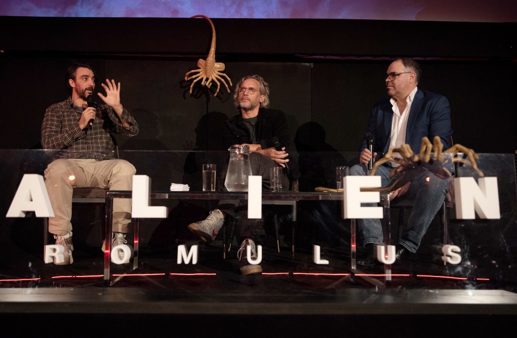 Uruguayan co-scriptwriter Rodolfo Sayagues (L) speaks next to filmmaker Federico Alvarez (C) and event host Christian Font during a press-junket for their co-production 'Alien Romulus' in Montevideo on August 5, 2024. Alvarez's Alien: Romulus will be in theatres worldwide from August 15, 2024. (Photo by Sofia TORRES / AFP)