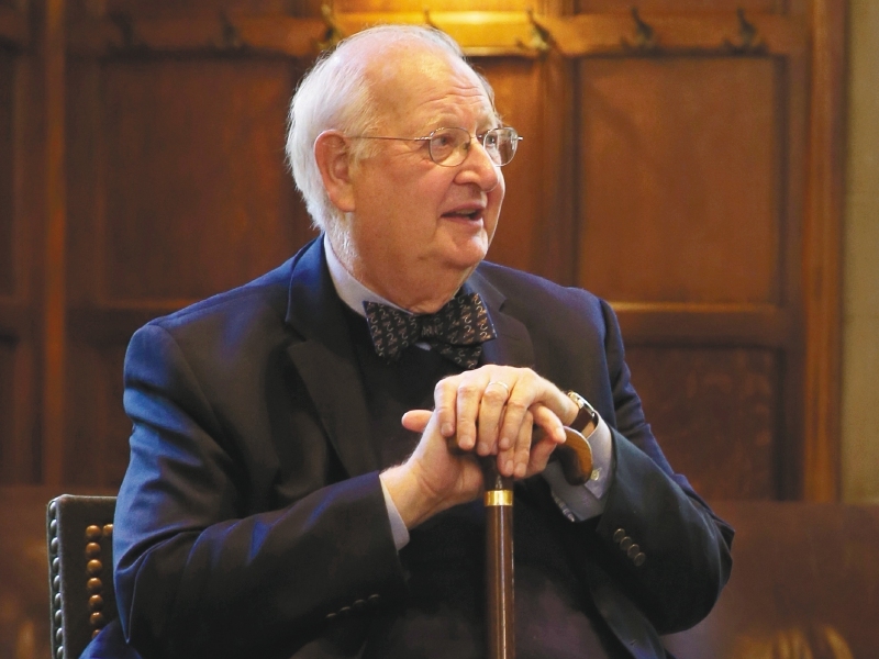 Angus Deaton sits at a gathering in his honor at Princeton University after it was announced that he won the Nobel prize in economics, Monday, Oct. 12, 2015, in Princeton, N.J.  Deaton, 69, won the 8 million Swedish kronor (about $975,000) prize from the Royal Swedish Academy of Sciences for improving understanding of poverty and how people in poor countries respond to changes in economic policy. (AP Photo/Mel Evans)
