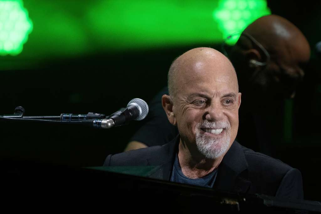 (FILES) US musician Billy Joel performs during a concert at the Formula One Grand Prix at Circuit of the Americas in Austin, Texas on October 23, 2021. Joel is cancelling a series of global tour dates after being diagnosed with a brain condition that worsened because of recent performances, his staff said on May 23, 2025. "Billy Joel has announced that he will be cancelling all scheduled concerts following a recent diagnosis of Normal Pressure Hydrocephalus (NPH)," the Piano Man's team wrote on his website. (Photo by SUZANNE CORDEIRO / AFP)