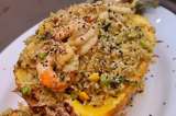 Receta para preparar arroz frito con langostinos, piña y curry