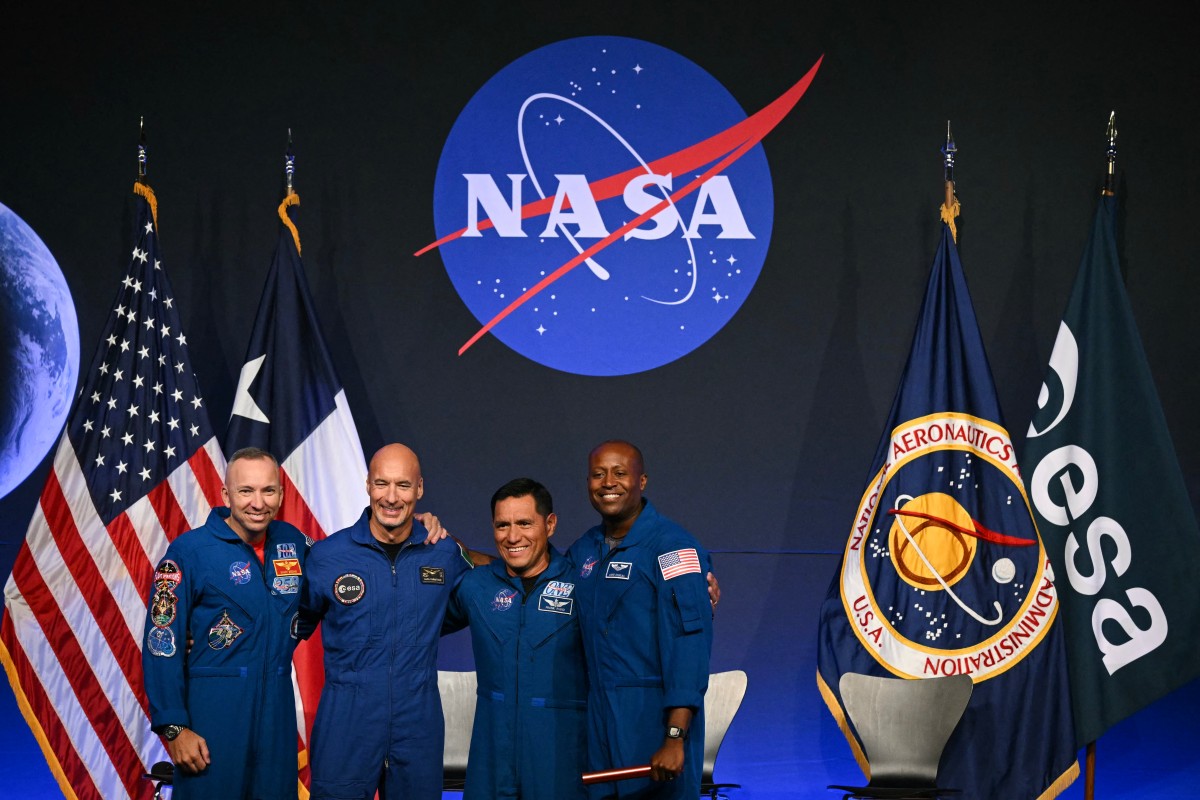 (L/R) NASA astronaut commander Randy Bresnik, ESA (European Space Agency) astronaut pilot Luca Parmitano, NASA astronaut mission specialist Frank Rubio, and NASA astronaut mission specialist Andre Douglas speak during a press conference announcing the crew for the Artemis III mission at NASA's Johnson Space Center in Houston, Texas, on June 9, 2026.