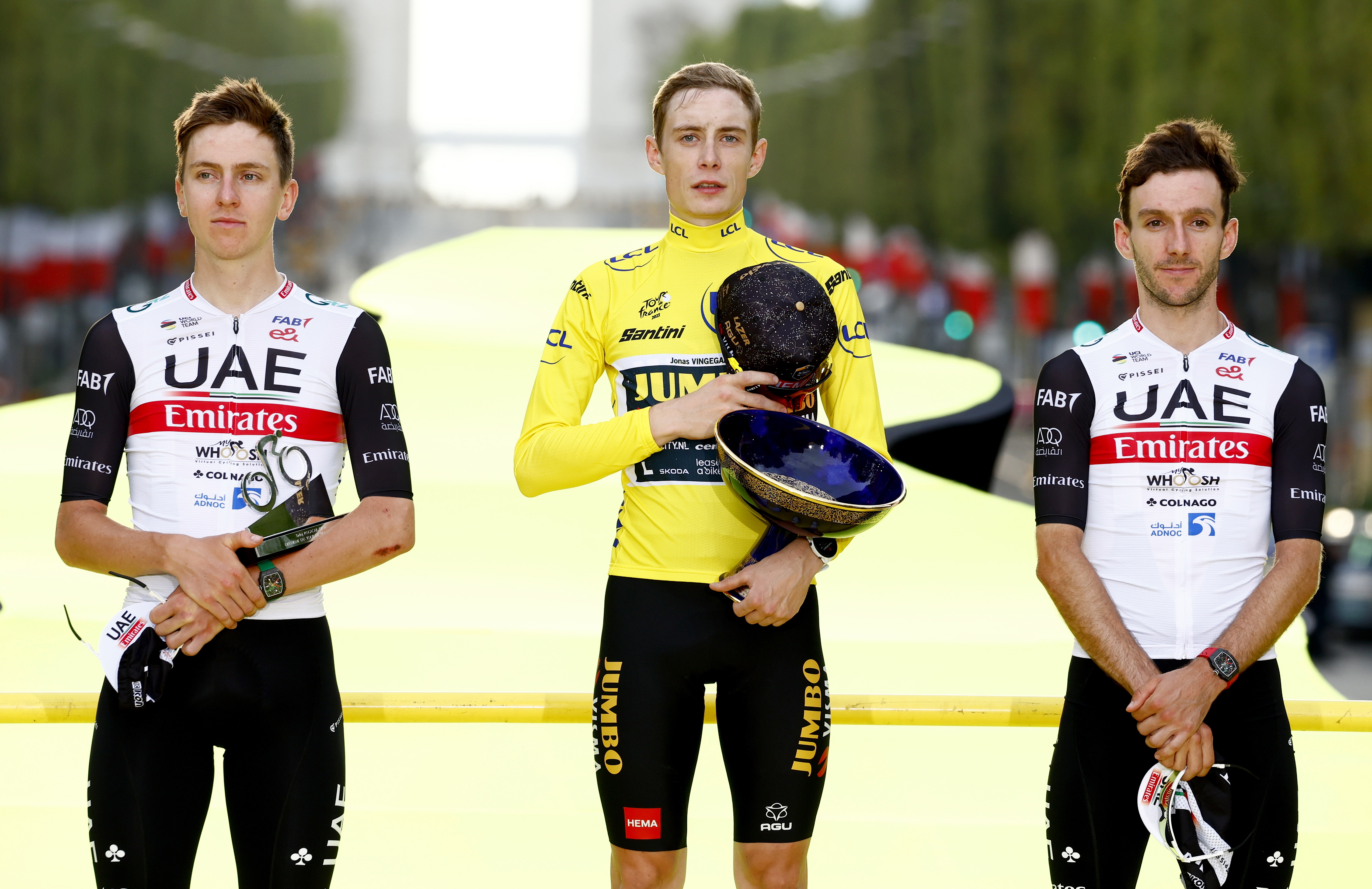 Paris (France), 23/07/2023.- Yellow Jersey and Tour de France overeall winner Danish rider Jonas Vingegaard (C) of team Jumbo-Visma, second placed Slovenian rider Tadej Pogacar (L) of team UAE Team Emirates and third placed British rider Adam Yates of team UAE Team Emirates on the podium after the 21st and final stage of the Tour de France 2023 over 115kms from Saint-Quentin-en-Yvelines to Paris Champs-Elysee, France, 23 July 2023. (Ciclismo, Francia, Eslovenia) EFE/EPA/ETIENNE GARNIER / POOL