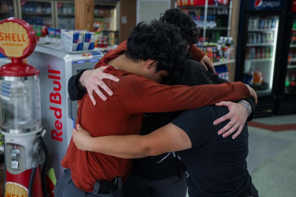 Kenner (United States), 06/12/2025.- People hug inside their family-operated gas station shop as Border Patrol agents patrol outside in Kenner, Louisiana, USA, 05 December 2025. About 250 federal Border Patrol agents are deployed to New Orleans and surrounding areas as part of the US president Trump administration's ongoing crackdown on undocumented immigration. (Nueva Orleáns) EFE/EPA/OLGA FEDOROVA