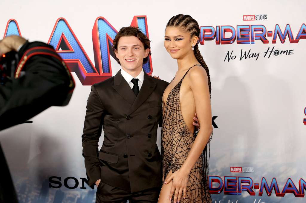 (FILES) British actor Tom Holland and US actress Zendaya attend Sony Pictures' "Spider-Man: No Way Home" Los Angeles Premiere on December 13, 2021 in Los Angeles, California. With "The Odyssey" and a new "Spider-Man" film, next summer looks set to be the summer of Tom Holland -- and the famously boyish and ebullient star can hardly contain his excitement. (Photo by Emma McIntyre / GETTY IMAGES NORTH AMERICA / AFP)