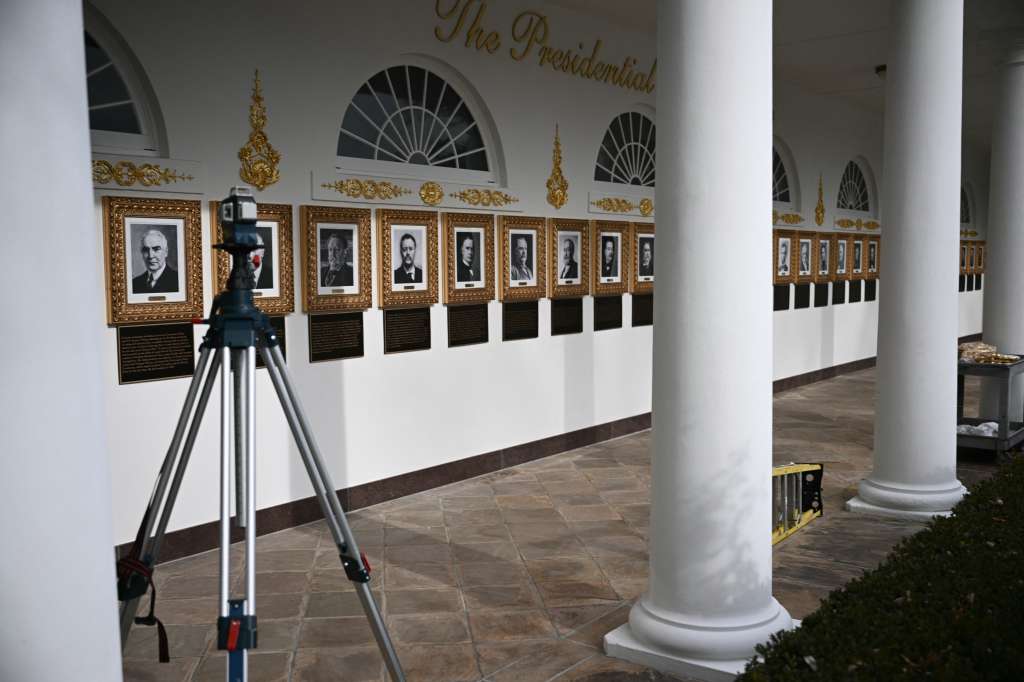 Portraits with new plaques of explanatory text are seen on the Presidential Walk of Fame on the Colonnade of the White House in Washington, DC, on December 17, 2025. (Photo by Brendan SMIALOWSKI / AFP)