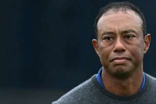 (FILES) US golfer Tiger Woods reacts on the 18th green after his first round 79 on the opening day of the 152nd British Open Golf Championship at Royal Troon on the south west coast of Scotland on July 18, 2024.