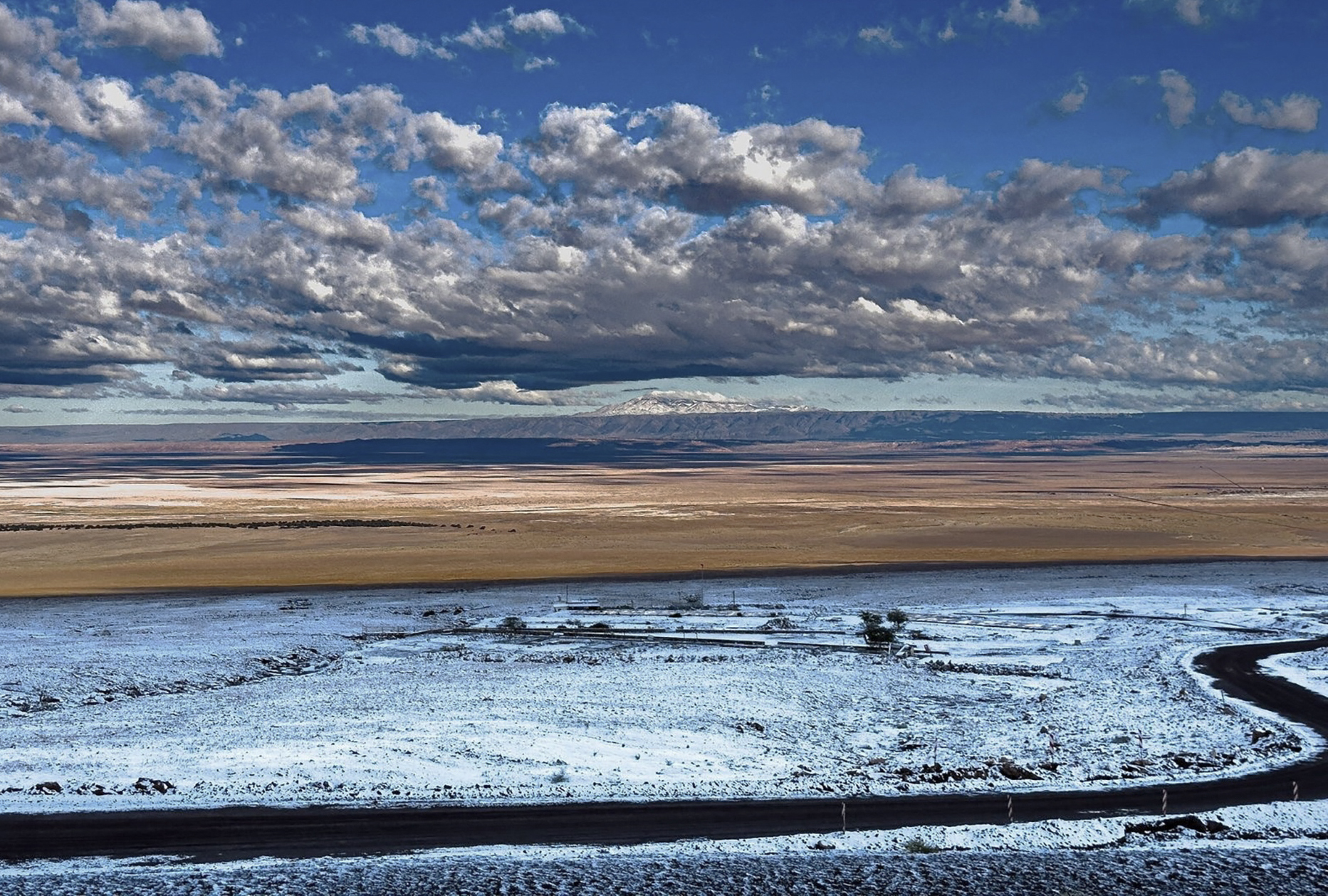 This handout picture released by the ALMA Observatory in the Atacama Desert shows snowfall at dawn, a phenomenon that had not occurred in 10 years, in Atacama, northern Chile, on June 26, 2025. (Photo by F. BESSER / ALMA / AFP) / RESTRICTED TO EDITORIAL USE - MANDATORY CREDIT "AFP PHOTO / ALMA OBSERVATORY" - NO MARKETING NO ADVERTISING CAMPAIGNS - DISTRIBUTED AS A SERVICE TO CLIENTS